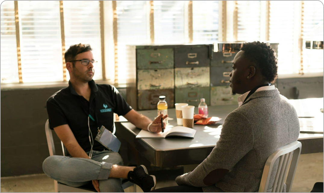 business people listening having a conversation at a desk