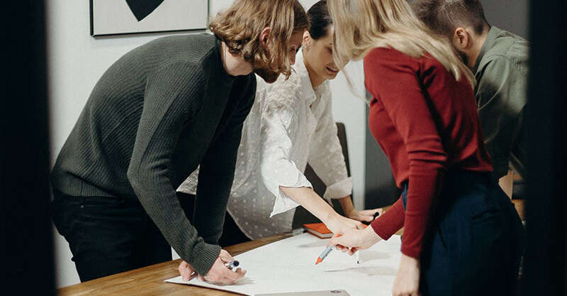 People stood at a table working