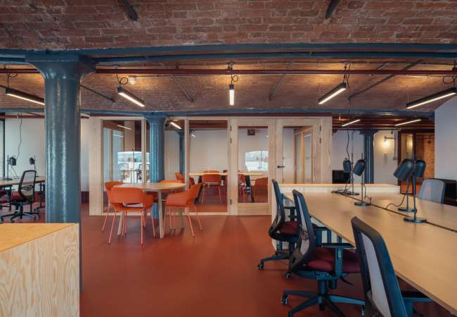 Interior of the open office includes timber meeting rooms