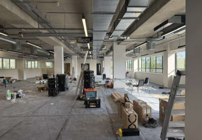 open plan office stripped ready and prepared for rooms tracks to be fitted for glass to follow