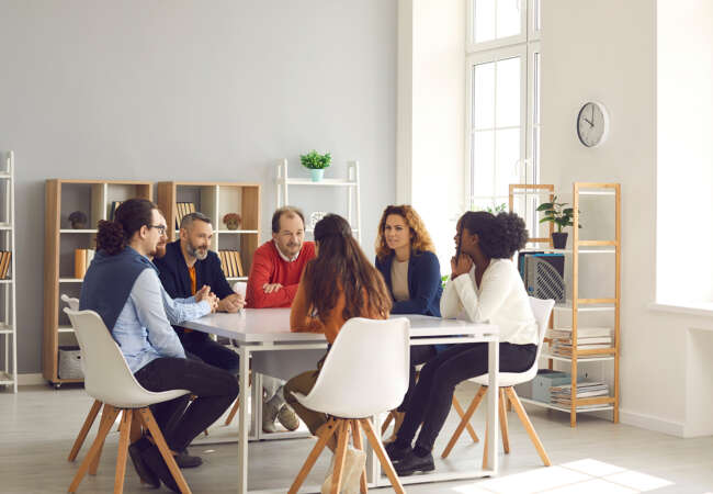 People sat around a table working