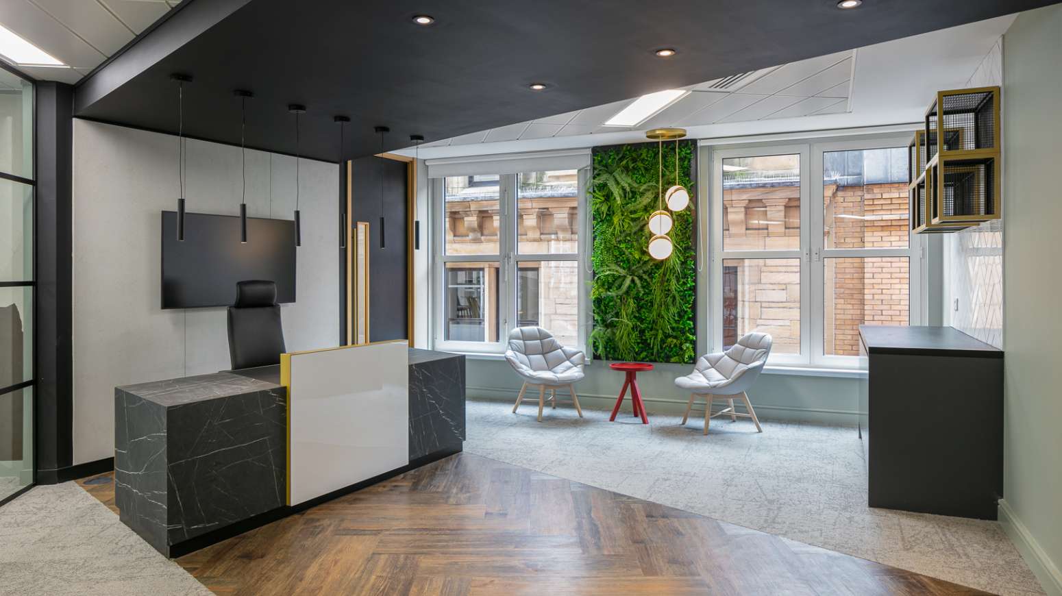 reception entrance with desk and waiting area with green wall