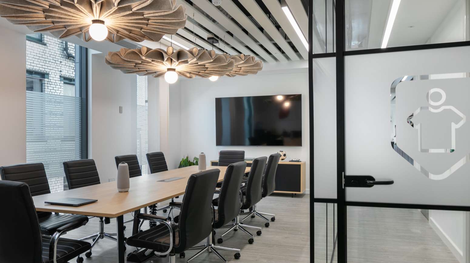 meeting table with chairs AV and logo