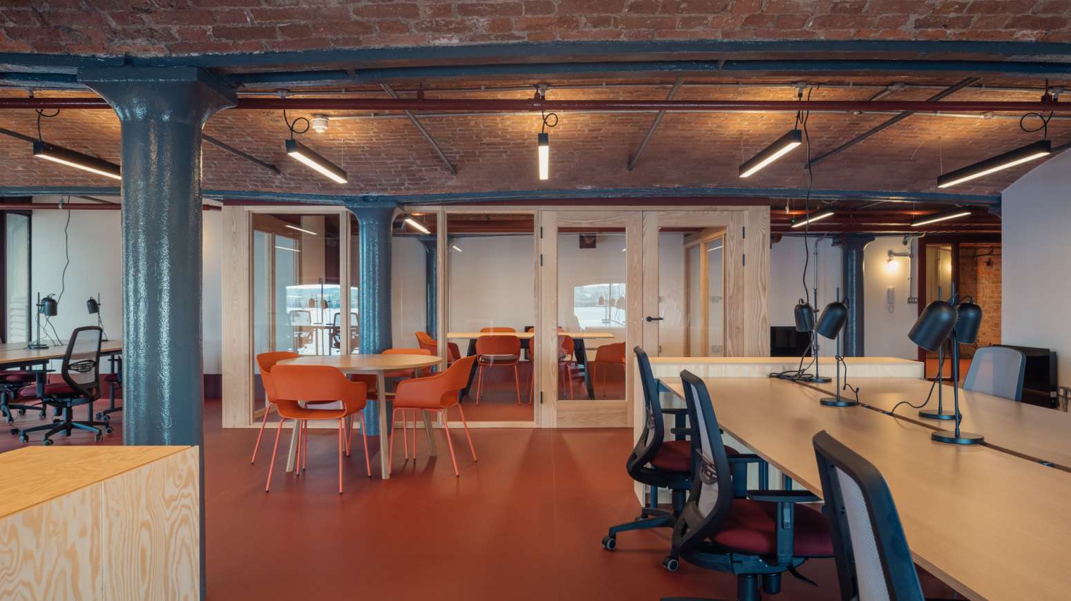 Interior of the open office includes timber meeting rooms
