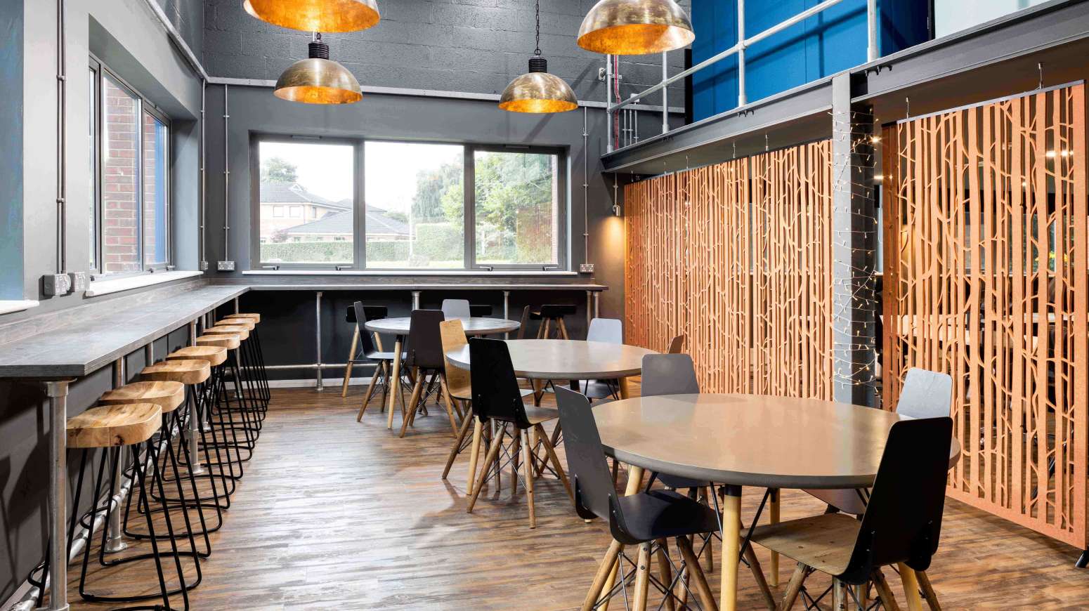 break area with stools tables and chairs and acoustic panels