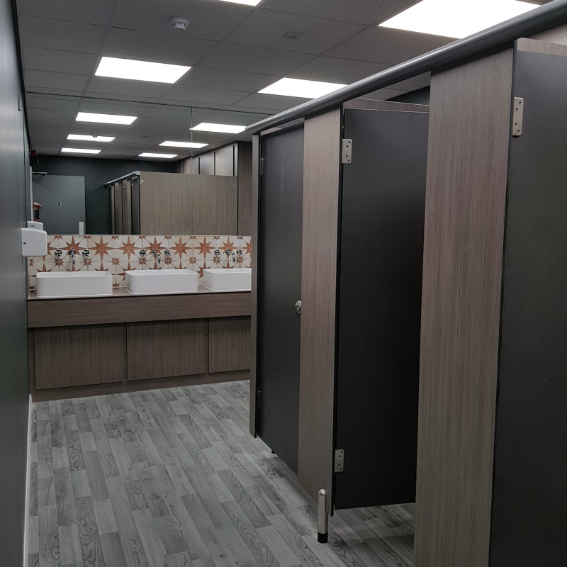 looking into the WC's with cubicles and wash basins