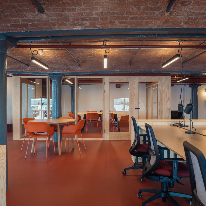 Interior of the open office includes timber meeting rooms