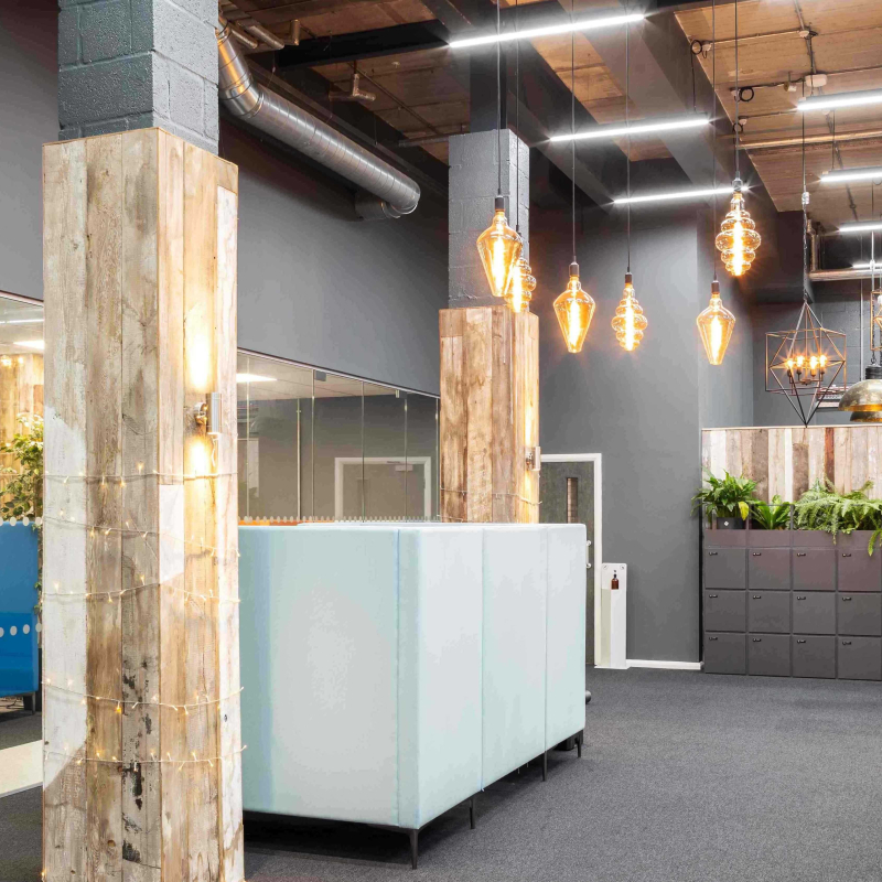 atrium into the office with meeting booths and view into call centre and meeting spaces