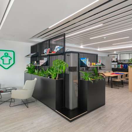 reception with two kudos seats harp dividing screens  and open plan office