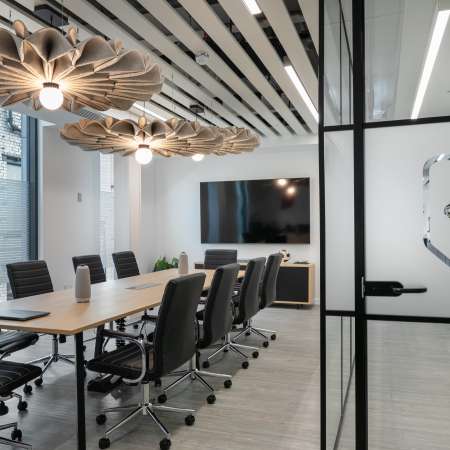 meeting table with chairs AV and logo