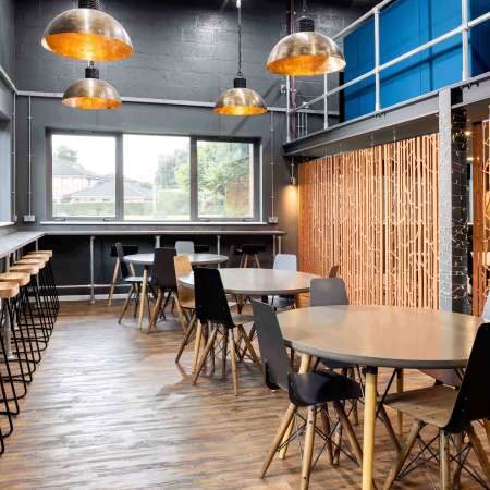 break area with stools tables and chairs and acoustic panels
